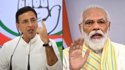 Randeep Surjewala and PM Modi 
