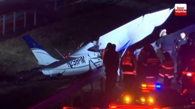 Plane crashes into railing on New York highway, major accident averted