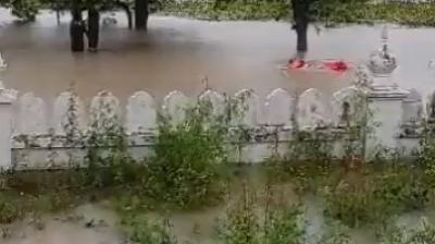 SDM Khamano Sanjeev Kumar jumps in flood to save man