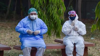 Corona exemplifies 'ambulance couple' by helping patients and cremating the dead