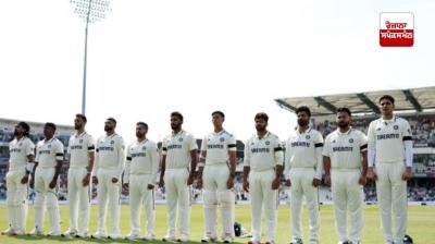 Indian and England cricketers observe a minute's silence in memory of those killed in the plane crash