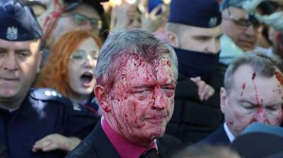 Red paint thrown at Russian envoy to Poland by anti-war protesters