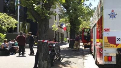Firefighters outside the Indian and French consulates in Melbourne