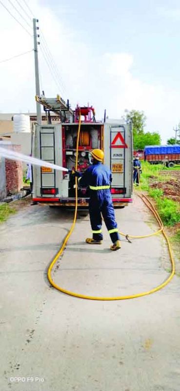 Employee doing sanitization at village Jawaharpur