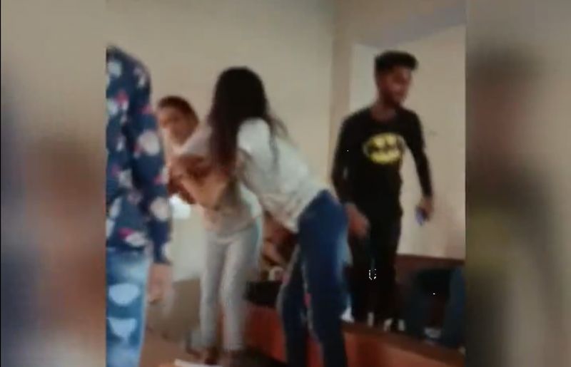 College students fighting in classroom