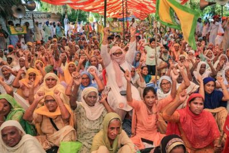 Flags of Kisan Unions in the hands of old women and children