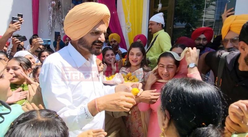 Balkaur Singh distributed laddus and put bhangra