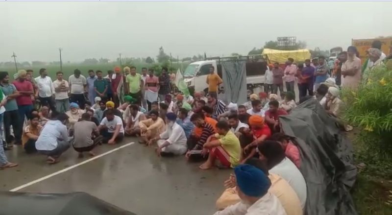 Family members and villagers in the rain to bring justice to Lovepreet