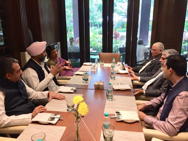 Manpreet Singh Badal and Vijay Inder Singla deliberating with the Co-founder of Infosys Nandan Nilekani