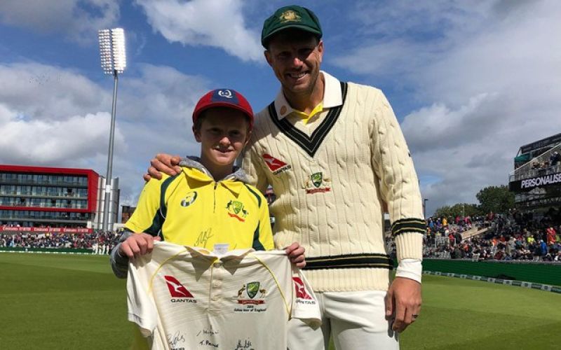 12 year old Max Waight collects garbage for watching the Ashes
