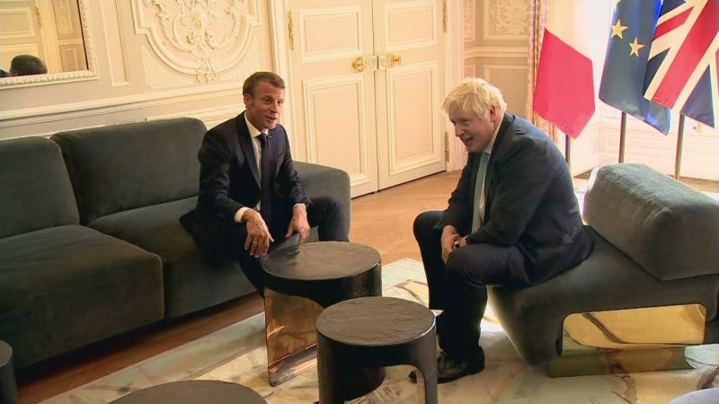 Foot on table: British PM at home in French president palace