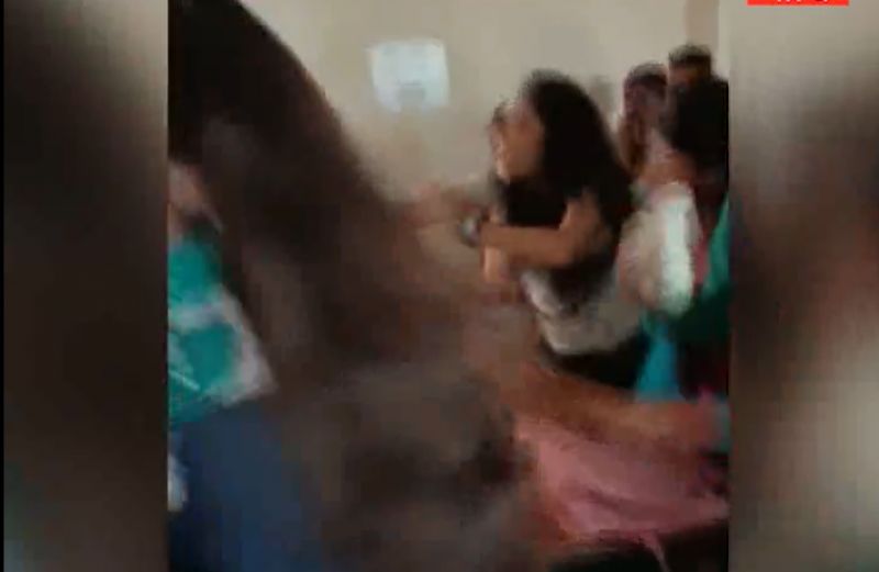 College students fighting in classroom