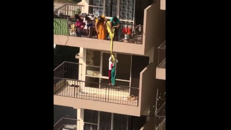 Mother hangs son from 10th floor balcony by saree