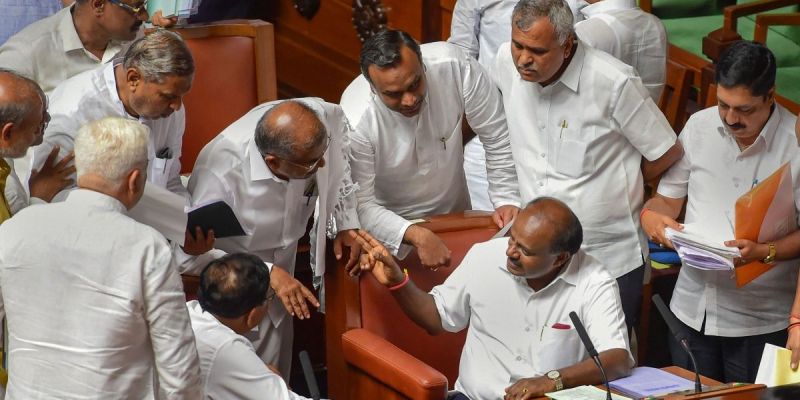 Karnataka chief minister H.D. Kumaraswamy and his deputy G. Parameshwara with other member