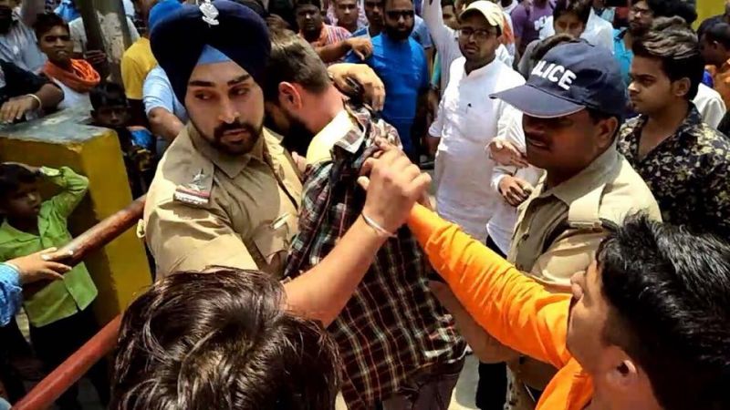 Inspector Gagandeep Singh and the Muslim youth he saved from the mob in Ramnagar