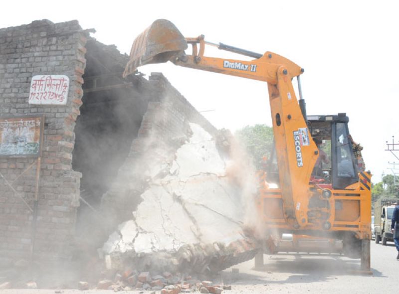 Unlawful possession of JCB removal in Dehradun
