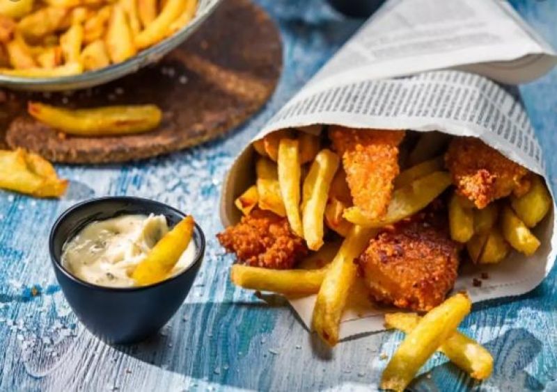 Wrapping food in newspaper 