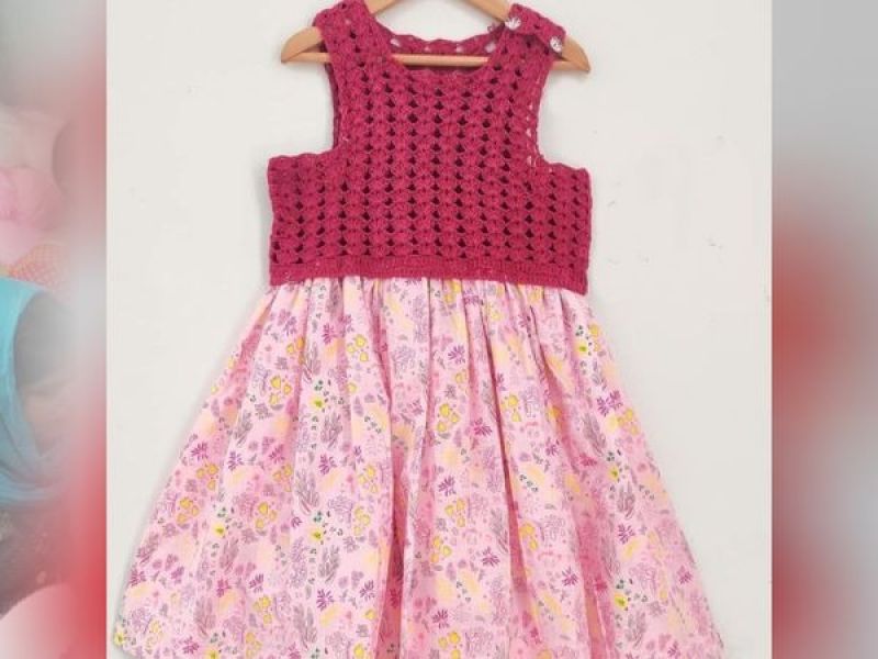 Grandma made a frock at home for her granddaughter