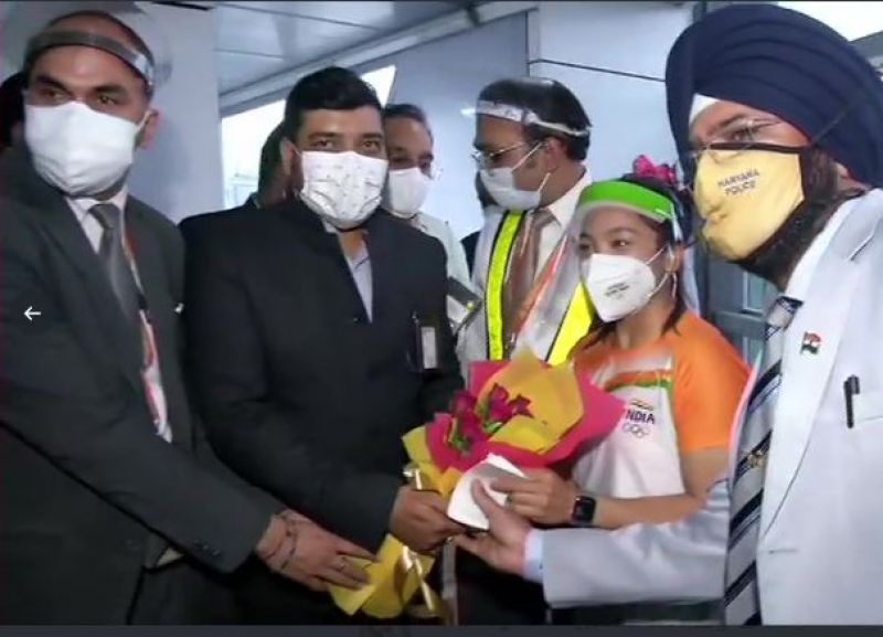 Olympic silver medalist Mirabai Chanu arrives at the airport from Tokyo