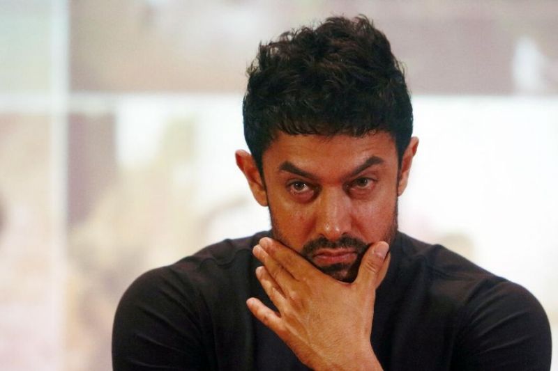 Aamir Khan seen wearing a uniform in clean shave 
