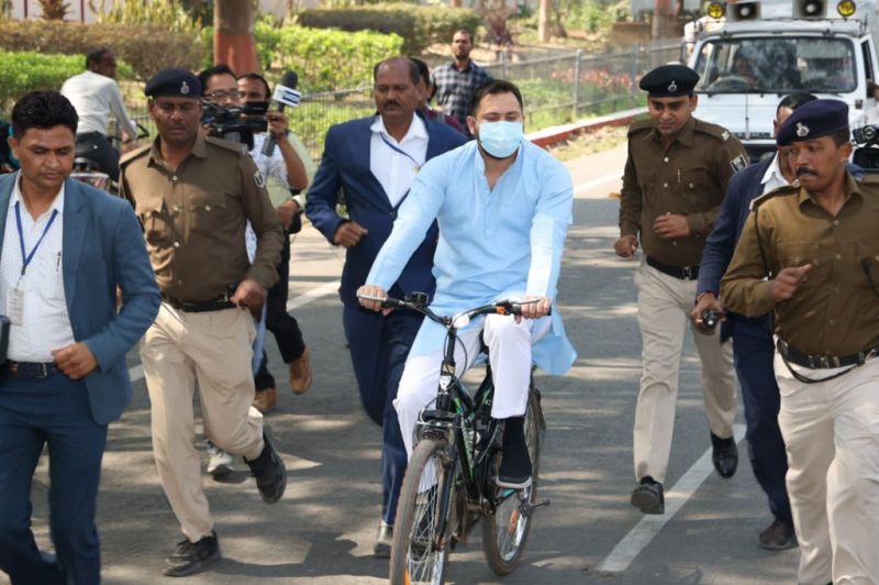 RJD leader Tejashwi Yadav rides a bicycle to the Secretariat