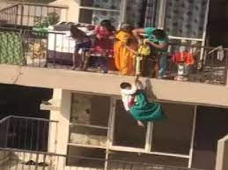 Mother hangs son from 10th floor balcony by saree