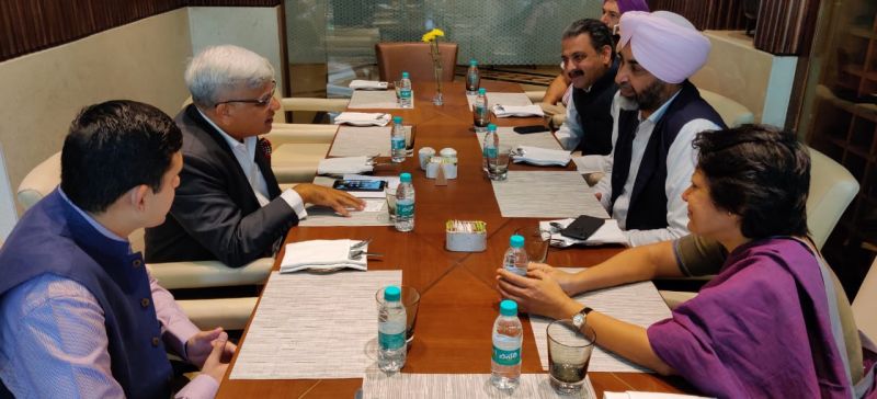 Manpreet Singh Badal and Vijay Inder Singla deliberating with the Co-founder of Infosys Nandan Nilekani