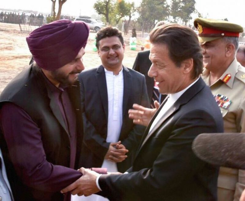 Imran Khan shakes hands with Navjot Singh Sidhu